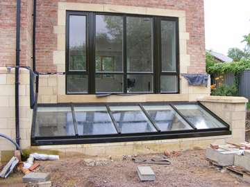 Newton Le Willows : Installation of HWL Thermally broken Aluminium Patent Glazing system. Polyester Powder coated in a Satin marine finish Ral 9017. Windows and doors S 300 Aluminium Profile